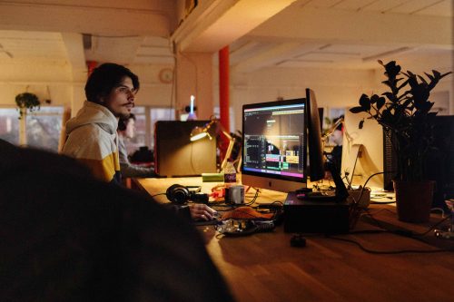 Person working at a computer desk