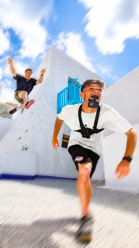 Two people doing parkour while filming